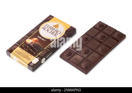 Alba, Italy - February 25, 2023: Package of Ferrero Rocher Dark bar with chocolate bar and hazelnuts isolated on white, clipping path included Stock Photo