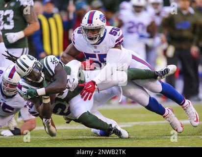 November 11, 2018 - East Rutherford, New Jersey, U.S. - Buffalo Bills  offensive tackle Dion Dawkins (73) catches a touchdown pass as New York  Jets linebacker Jeremiah Attaochu (55) tries to defend