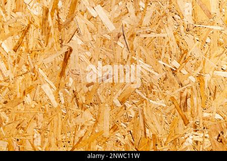 Full frame close-up on a Oriented strand board (OSB), also known as flakeboard, sterling board and aspenite. Stock Photo
