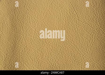 light beige background from genuine leather, solid beige background close-up Stock Photo