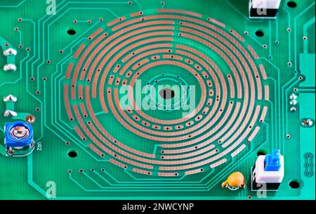 Changeover switch integrated in PCB copper layer, on-off button or resistor trimmer. Range selector in printed circuit board from inside of multimeter. Stock Photo
