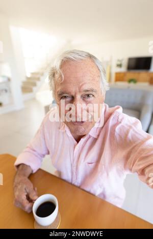 Happy senior caucasian man having video call Stock Photo