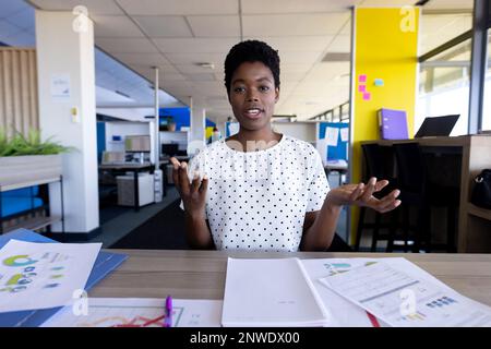 African american businesswoman having video call at office Stock Photo