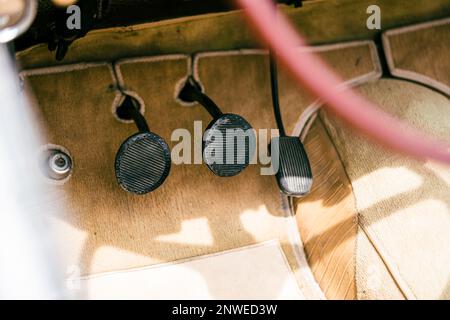 Vintage vehicle acceleration, brake and clutch pedals. Stock Photo