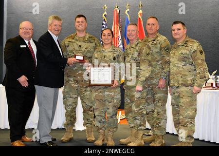 Capt. Ben Andrews and 1st Sgt. Alena Hoesley receive the 2021 Air Traffic Control Facility of the Year Award on behalf of Braman Hall, Company C, 1st Battalion, 13th Aviation Regiment, Fort Rucker, during the Army Aviation Senior Leader Forum at Fort Rucker, Alabama, Jan. 25, 2023. Presenting the award is Maj. Gen. Michael McCurry, U.S. Army Aviation Center of Excellence commander and Army aviation branch chief, Chief Warrant Officer 5 Myke Lewis, chief warrant officer of the branch, Command Sgt. Maj. James Wilson, branch command sergeant major, retired Maj. Gen. William T. Crosby, Army Aviati Stock Photo