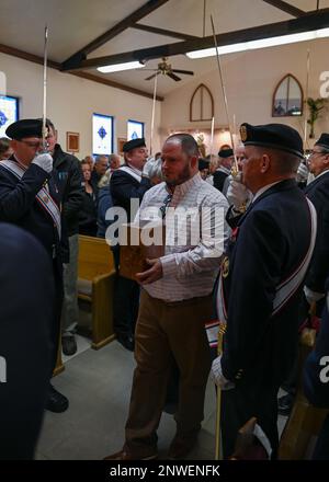 A family member carries Chief Master Sgt. (Ret.) Paul Kerchum’s ashes into Kerchum’s funeral in Benson, Ariz., Jan. 25, 2023. Kerchum passed away Dec. 17, 2022, and was laid to rest with full military honors on, what would have been, his 103 birthday. Stock Photo