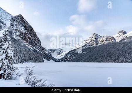 Iconic Lake Louise in winter time with frozen lake below scenic view ...
