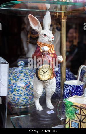 White Rabbit with a pocket watch ornament on Alice's window display on Portobello Road, Notting Hill, London, England Stock Photo