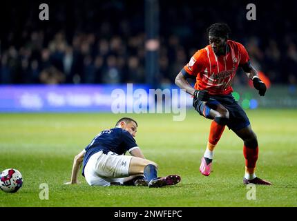 Luton Town's Elijah Adebayo (right) and Millwall's Murray Wallace battle for the ball during the Sky Bet Championship match at Kenilworth Road, Luton. Picture date: Tuesday February 28, 2023. Stock Photo