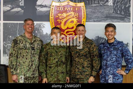 U.S. Navy Rear Adm. Derek Trinque, commander Task Force 76/3, left, and ...
