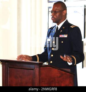 Illinois Army National Guard Chaplain (Lt. Col.) Vince Lambert speaks at his promotion ceremony in Memorial Hall in the Illinois Army National Guard's historic General Richard L. Jones Armory on Chicago's South Side. Chaplain Lambert, of Evergreen Park, Illinois, spent nearly two decades in finance, investment and bank management before deciding to join the Army as a member of the Chaplain Corps. “It was a surprising pivot,” said LaTonia Lambert, who has been married to Lambert for 28 years but has only been an Army Chaplain's wife for half that time. 'It was something he really wanted to do. Stock Photo