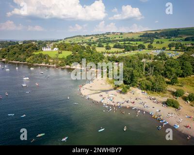 Aerial view of a crowded beach on the shore of a large lake in summer (Ullswater, Lake District, England). Stock Photo