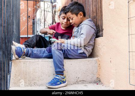 San Miguel de Allende Guanajuato Mexico,Historico Central historic center Zona Centro,friends looking at child children childhood,kid kids,resident re Stock Photo