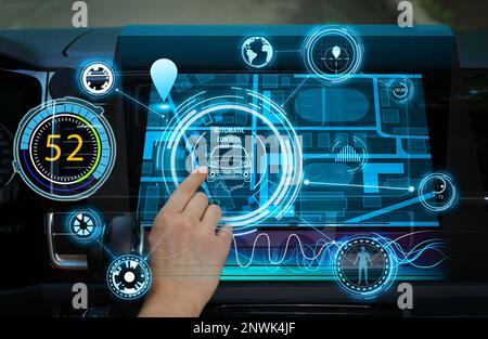 Woman using navigation system while driving car, closeup Stock Photo