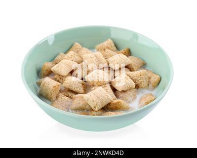Tasty corn pads with milk in bowl isolated on white Stock Photo