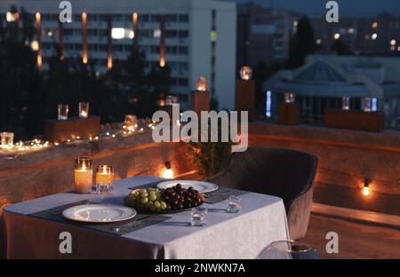 Beautiful view of modern cafe with outdoor roof terrace in evening Stock Photo