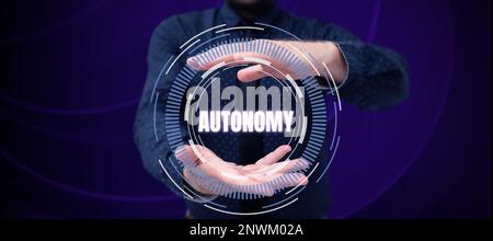 Sign displaying Autonomy, Word Written on vehicle that can guide itself without human conduction Stock Photo
