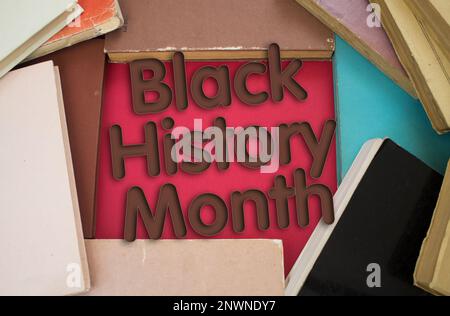 Black History Month word in opened book with vintage, natural patterns old antique paper design. Stock Photo