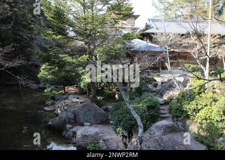 The garden of a traditional Japanese hotel in Miyajima, Hiroshima, Japan Stock Photo