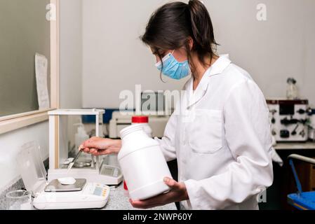 Female Scientist Working in Laboratory Stock Photo