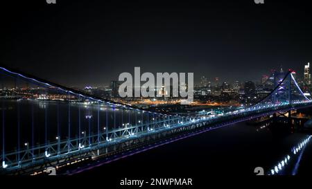 Ben Franklin Bridge and Skyline of Philadelphia at night - aerial view Stock Photo