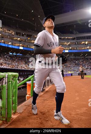 MIAMI, FL - AUGUST 22: New York Yankees left fielder Giancarlo Stanton (27)  runs out to right field during the fourth inning in a game between the  Miami Marlins and the New