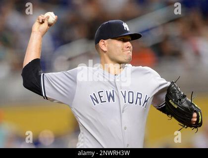 MIAMI, FL - AUGUST 22: New York Yankees left fielder Giancarlo Stanton (27)  runs out to right field during the fourth inning in a game between the  Miami Marlins and the New