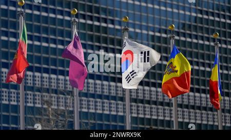 Flags of different nations at United Nations Plaza in New York - NEW YORK CITY, USA - FEBRUARY 14, 2023 Stock Photo