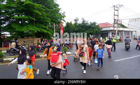 The Activity Of The People Walking Leisurely On The Streets Of Muntok City In The Morning Stock Photo