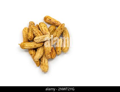 Top view a pile of stream peanuts, a small heap of peanuts with shells, and Isolated image on white background. Stock Photo
