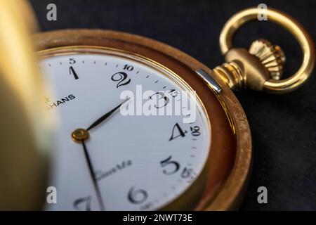 Summer time, winter time, symbolic photo of a pocket watch for the time change, studio shot, Germany Stock Photo