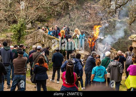 Montalegre, Portugal. 19th Feb, 2023. People are seen watching the Burning celebration during Misarela Entrudo. Entrudo da Misarela is a socio-cultural dynamization project that aims to bring the two banks of Rabagão closer together, around the same idea: to recreate Entrudo as a celebration of the 'entrance' of Spring. The event happens in the Misarela bridge, a bridge that was built in the middle ages, located in Montalegre in the North East of Portugal. Credit: SOPA Images Limited/Alamy Live News Stock Photo