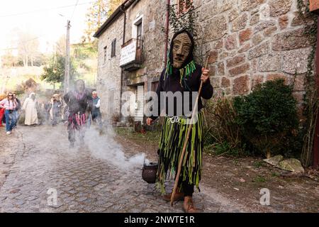 Montalegre, Portugal. 19th Feb, 2023. Misarela Caretos parade during the Carnival Entrudo of Misarela, Montalegre, Portugal. Entrudo da Misarela is a socio-cultural dynamization project that aims to bring the two banks of Rabagão closer together, around the same idea: to recreate Entrudo as a celebration of the 'entrance' of Spring. The event happens in the Misarela bridge, a bridge that was built in the middle ages, located in Montalegre in the North East of Portugal. Credit: SOPA Images Limited/Alamy Live News Stock Photo