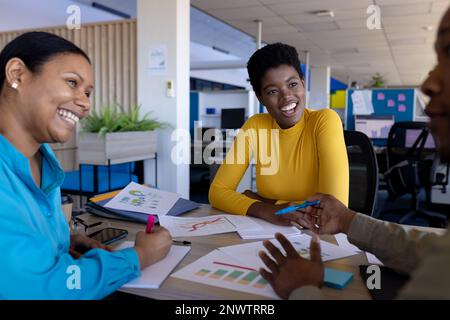 Diverse business people having meeting at office. Working at office, business, finances and corporation concept. Stock Photo