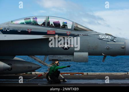 An E/A -18G Growler prepares to take off from the flight deck of USS ...