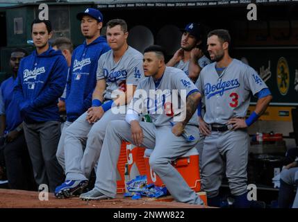 Los Angeles Dodgers players Brett Butler, left, Darryl Strawberry, middle,  and Lenny Harris, right, sit in the dugout after the final out as the San  Francisco Giants beat them 4-1 at Candlestick