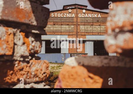 Gdansk, Poland - July 19 2022: Industrial building at the Gdansk Shipyard, former Lenin Shipyard, prefabrication workshop and heavy cranes large Polish shipyard. Cranes at historical shipyard in Gdansk headquarters of Solidarity Polska Stock Photo