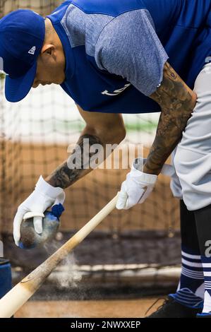 July 21 2018 A picture of Los Angeles Dodgers shortstop Manny Machado 8 getting his bat ready before batting practice and a tattoo on his right forearm of his wife during the