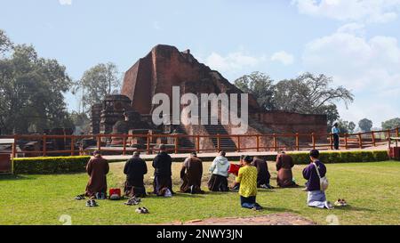 INDIA, BIHAR, NALANDA, February 2023, People are praying in front of Holy Nalanda University main structure, Rajgir Stock Photo