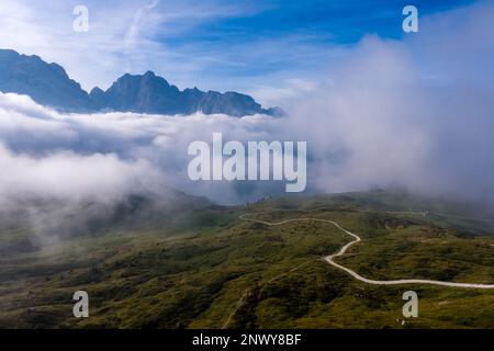 The main range of Brenta Dolomites, partially shrouded in clouds, seen from the mountain hut Rifugio Spinale. Stock Photo