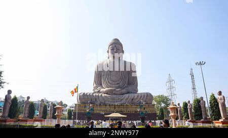 INDIA, BIHAR, BODH GAYA, January 2023, Tourist at statue of Lord Budhha in Meditation Pose, 80 feet Statue with 10 Disciples Stock Photo