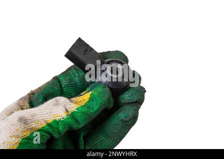 Knock sensor for vehicle engines spare parts electrical parts sensors in arm with glove on white background copy space Stock Photo