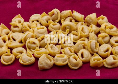 Raw Tortellini Pasta. Traditional Italian Pasta from Emilia-Romagna Stock Photo