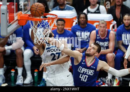 Los Angeles, United States. 28th Feb, 2023. Minnesota Timberwolves center Rudy Gobert (L) dunks and fouled by Los Angeles Clippers center Ivica Zubac (R) during an NBA game. Timberwolves 108:101 Clippers Credit: SOPA Images Limited/Alamy Live News Stock Photo