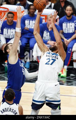 Minnesota Timberwolves center Rudy Gobert (27) is defended by Cleveland ...