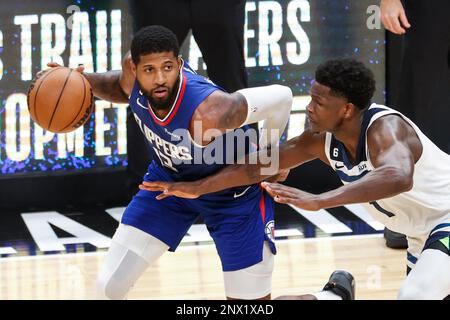 Los Angeles, United States. 28th Feb, 2023. Los Angeles Clippers forward Paul George (L) drives against Minnesota Timberwolves forward Anthony Edwards during an NBA game. Timberwolves 108:101 Clippers Credit: SOPA Images Limited/Alamy Live News Stock Photo