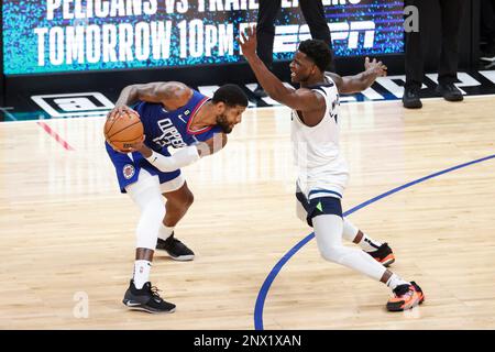 Los Angeles, United States. 28th Feb, 2023. Los Angeles Clippers forward Paul George (L) is defended by Minnesota Timberwolves forward Anthony Edwards during an NBA game. Timberwolves 108:101 Clippers Credit: SOPA Images Limited/Alamy Live News Stock Photo