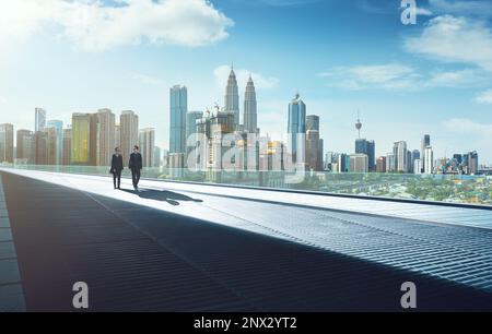 Businessmen talking on modern city street Stock Photo