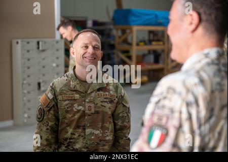 U.S Air Force Command Chief Master Sgt. John Storms, Air Combat Command, participates in a demonstration with Task Force 99 Airmen at Al Udeid Air Base, Qatar, Feb. 11, 2023. TF99 is an agile, specialized unit designed to innovate and enhance Ninth Air Force's (Air Forces Central) capabilities within all domains ensuring mission success. Stock Photo