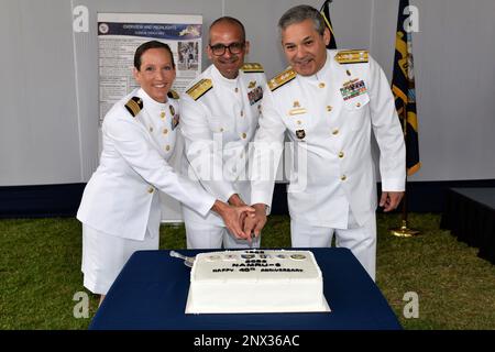 LIMA, Peru (Jan. 19, 2023) Capt. Franca Jones, commanding officer, Naval Medical Research Unit (NAMRU)-6, Rear Adm. Guido F. Valdes, commander, Naval Medical Forces Pacific and Rear Adm. Jorge Enrique Andaluz Echevarría, surgeon general of the Peruvian Navy, perform a cake-cutting for the NAMRU-6 40th anniversary at the U.S. Embassy Campus. NAMRU-6 hosted several visitors and guests from the U.S. and Peru at the event, to include U.S. Ambassador to Peru Lisa Kenna and Capt. William Denniston, commander, Naval Medical Research Center. Visitors provided remarks celebrating the history of the com Stock Photo